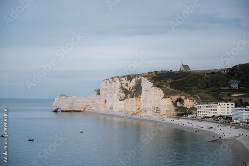 September 27, 2025 - Etretat, France view on alabaster coastline, white cliffs and chapel. travel destination