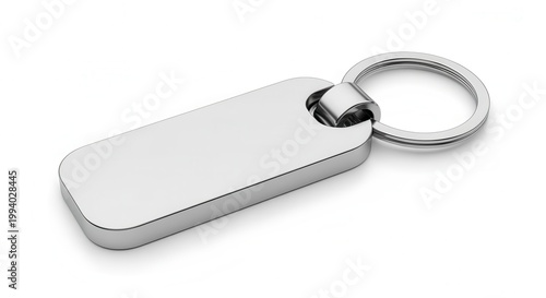Isolated silver keychain on white background, top view, macro studio shot. Shiny metal gift, product, accessory. Mockup of design, minimalist style.