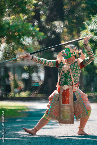 Traditional Thai Masked Dance Performance with Spear in Natural Setting