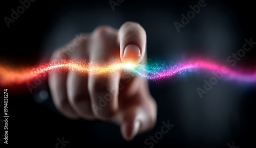 Close up of a finger touching a vibrant stream of colorful light particles and energy waves