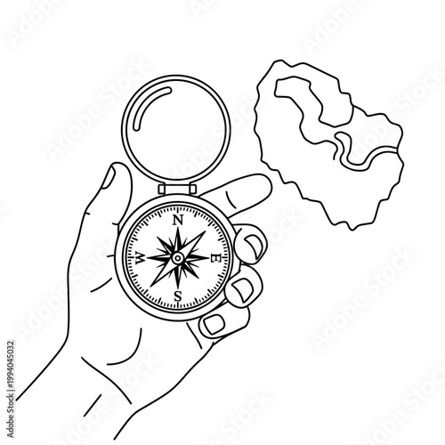 Hand holding a navigation compass device.