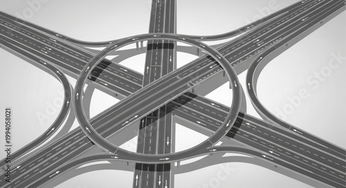Complex highway interchange viewed from above in grayscale.