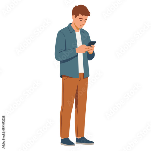 A man in casual attire stands looking at his phone with interest indoors.