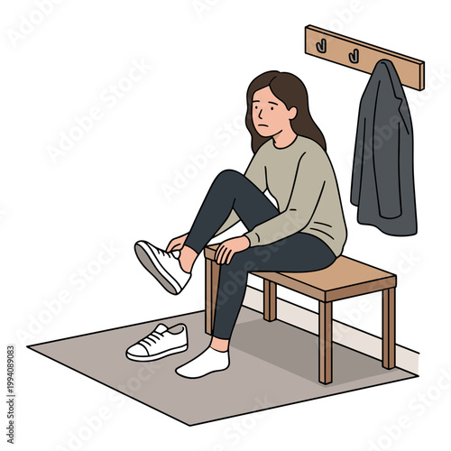 A woman sits on a wooden bench tying her white sneakers in a cozy indoor setting.