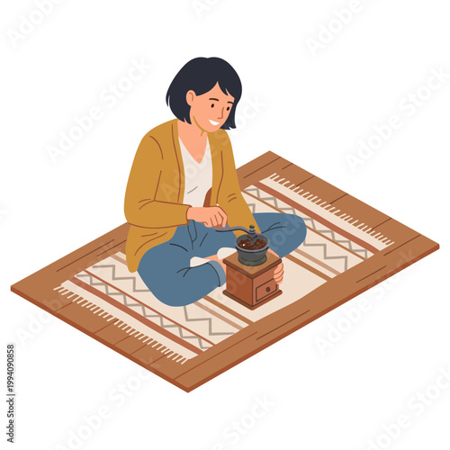 Woman sitting on a rug grinding coffee beans with a grinder.