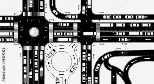 Aerial View of Busy City Intersection with Roundabout and Traffic.