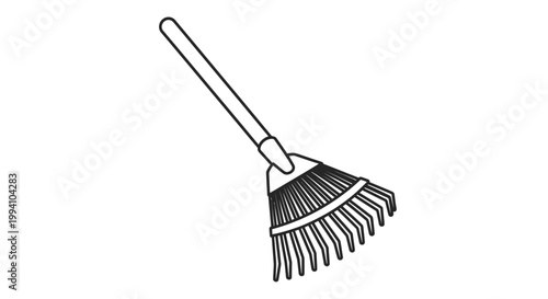 Broom with long wooden handle.