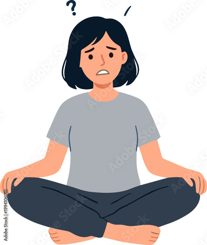 A worried woman sits cross-legged with a puzzled expression on her face.
