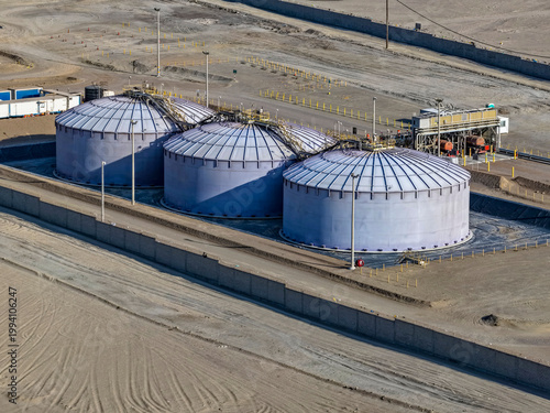 Panoramic view of enormous API tanks for sulfuric acid storage for the mining industry