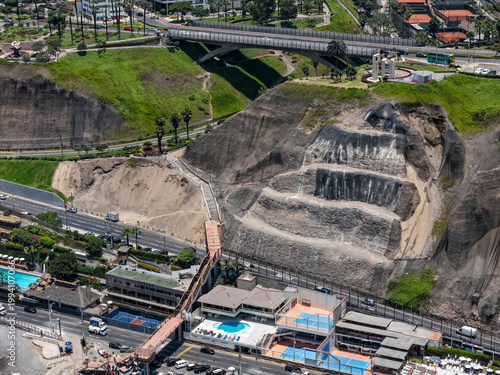 Cliff with slope stabilization treatment and mechanical anchors to prevent landslides
