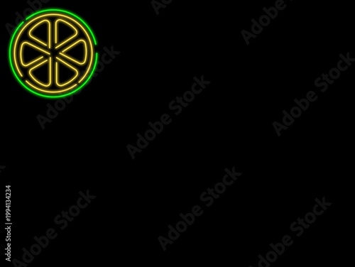 Neon sign depicting a citrus slice is illuminated on a black background. The design features alternating yellow and green segments, forming a circular shape representing a lemon or lime. The bright ne