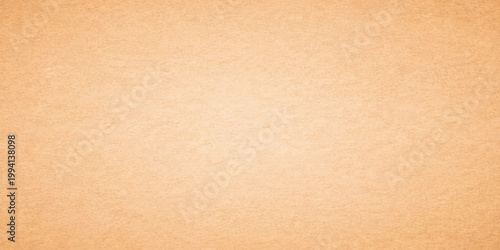 Vintage aged brown paper texture with a rough grunge pattern on blank antique cardboard material for a recycled beige parchment background design