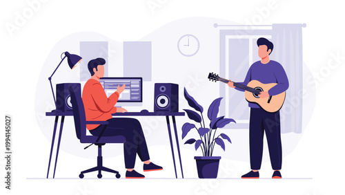 Professional home music studio where one man works on a computer while another plays acoustic guitar for audio production and recording.