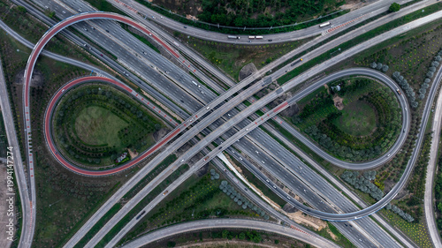 Konstfotografi Aerial top view symmetrical highway interchange crossroad highway junction, Highway intersection with traffic intersection, Interchanges elevate transportation highway intersection road express way