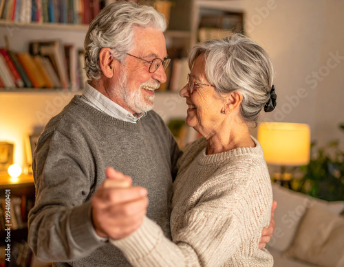 Senior couple dancing indoors