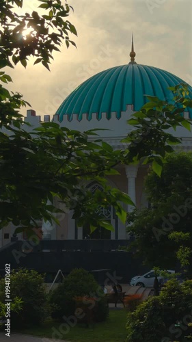 Temurids History Museum dome in Tashkent framed by green trees