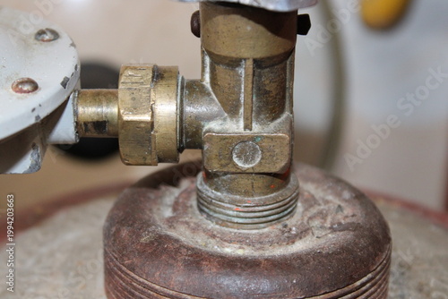 Fotografia Connection of a copper pipe to a LPG gas cylinder with brass fitting
