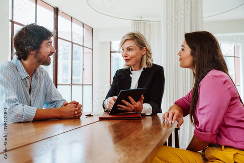 Real estate agent showing an apartment to a couple.