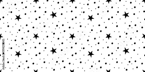 Black and white pattern featuring scattered stars and small dots