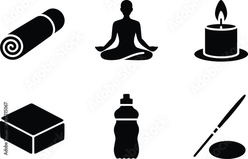 Set of black yoga and wellness including mat, meditating person, candle, block, and bottle