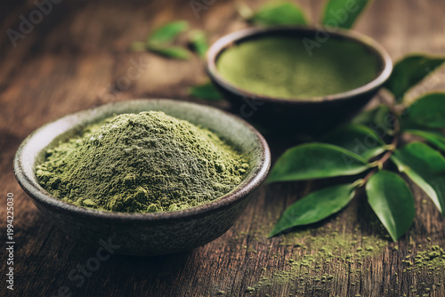 Matcha green tea powder rich in L-theanine in ceramic bowl with fresh leaves, rustic wooden background, calming wellness and natural balance 