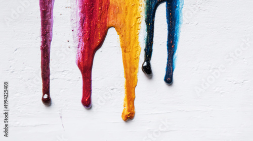 Bold abstract composition showing thick colorful paint streaks dripping vertically on a white textured canvas