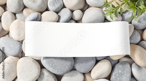 Blank Scroll on Pebbles with Greenery for Message