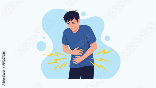 Young man clutching his stomach with a pained expression, experiencing severe abdominal discomfort or a painful stomach ache.