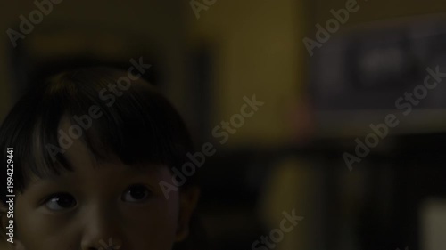 Toddler Eating Grapes Indoors, A sweet video of a toddler happily eating grapes, capturing pure childhood joy and healthy snacking, perfect for family lifestyle documentary and food advertising.