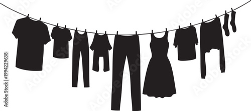 Clothes hanging on a drying line in silhouette