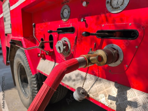 Details of the hose and lever of the fire truck.