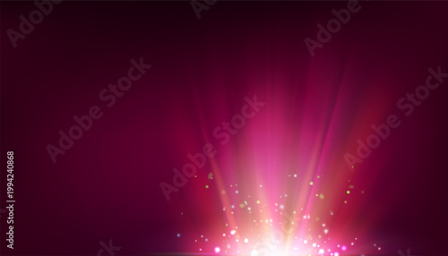 Bright light burst with radial rays on dark background