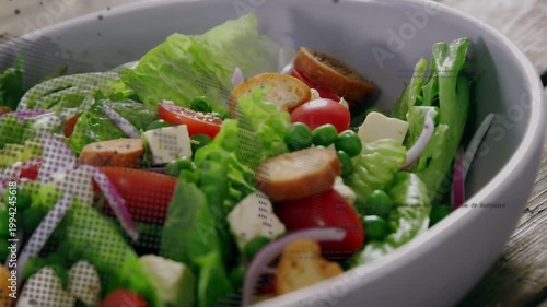 Vertical video: Overlay appearing cam moving in showing salad bowl on rustic table, showing texture