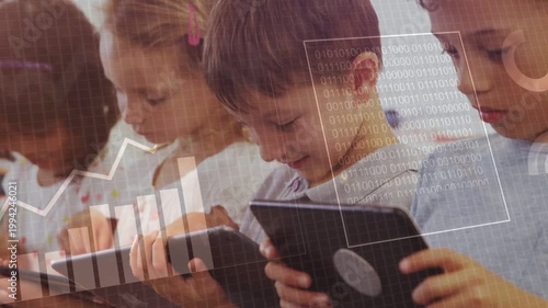 Students tapping tablets, HUD charts and graphs growing and showing class data for learning