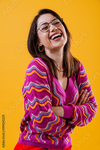 Confident young woman smiling with arms crossed