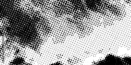 Abstract black and white halftone texture with dense dotted pattern and grunge dispersion effect, modern vector background for bold print, digital, and creative projects