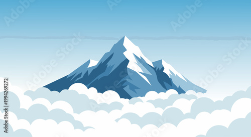 Snow capped mountain peak rising above thick cloud layer