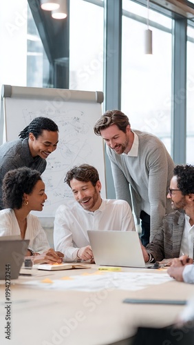 Diverse business team having creative brainstorming meeting around table in bright modern office
