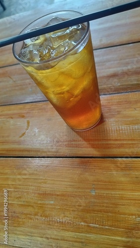 Refreshing Glass of Iced Sweet Tea on a Wooden Table