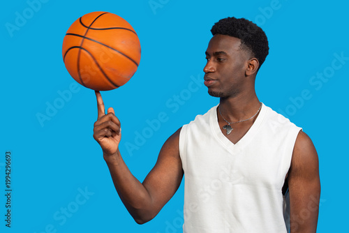 Bild auf Leinwand Male basketball player balancing spinning ball on finger