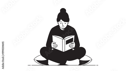 Young woman sitting cross-legged and reading a book in a relaxed indoor setting.