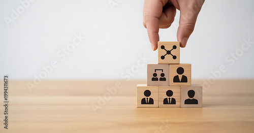 Networking and organizational structure built with wooden toy cubes.