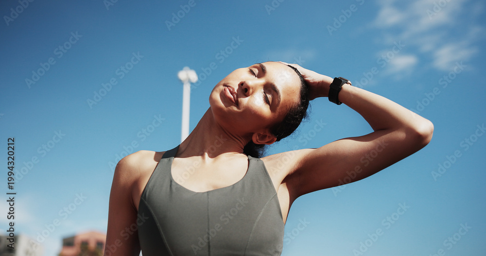 Obraz premium Fitness, woman and stretching neck in city for exercise, training and warm up for workout with blue sky. Sports, runner and person ready for wellness, health and mobility for active hobby in town