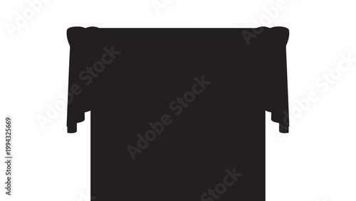 Close-up of a black and white cat resting on a windowsill with sunlight streaming in.