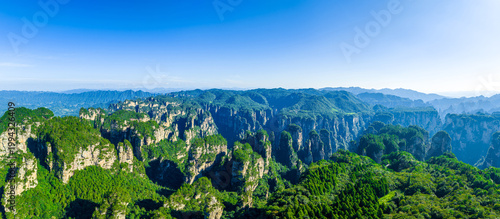 Impressive vertical quartz sandstone pillars with vegetation in Zhangjiajie National Forest Park, Hunan, China
