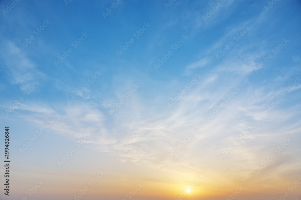 Fototapeta premium Blue Sky with Thin Clouds and Sunset Sun for Background
