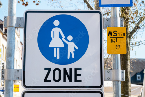 Traffic sign on the street. Pedestrians sign the walking zone.