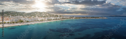 Slika na platnu Aerial view of Cannes on the French Riviera shows the Bay of Cannes, La Croisette, Carlton Cannes, and the Palais as yachts cluster, sunbathers rest, and villas rise