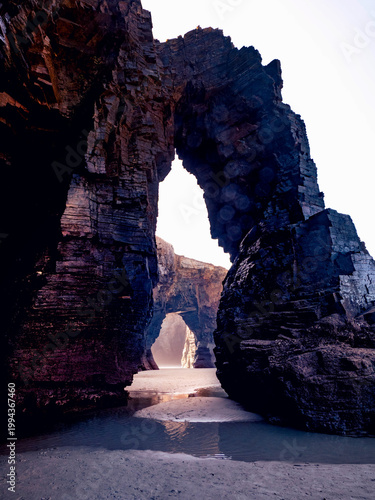 Fotografie Natural rock arches at As Catedrais Beach Lugo Galicia Spain