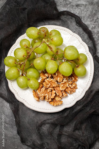 Fresh grapes on a white plate.